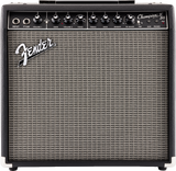 The image shows a Fender Champion 50 guitar combo amplifier with a black tolex exterior and silver grille cloth. The control panel features input and footswitch jacks, knobs for Volume, Gain, Voice, Treble, Bass, Modify, FX Select, Tap, auxiliary input, headphone output, and a power switch. This versatile 50-watt amp offers multiple voicings and built-in effects, ideal for practice and small performances.