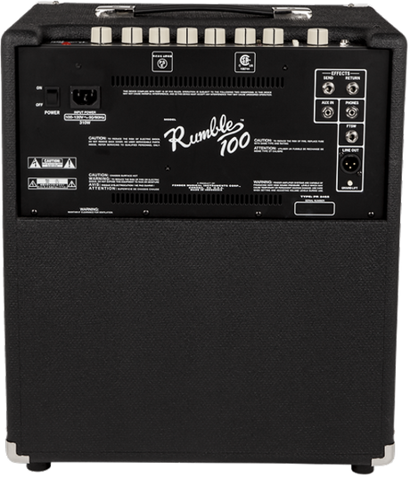 The image shows the back panel of a Fender Rumble 100 bass amplifier, featuring the classic Fender script logo, multiple input/output jacks, ventilation grilles, warning labels, and regulatory information. It has the black tolex covering and sturdy build typical of Fender amps. The Rumble 100 is a lightweight, powerful bass amp suitable for practice, recording, and small to medium venues.