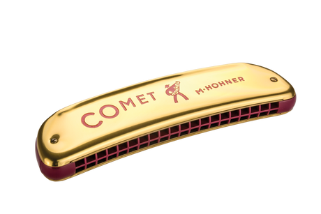 The image shows a Hohner "Comet" diatonic harmonica with a gold metal cover plate featuring red "COMET" text and the Hohner logo. It has a red/burgundy comb visible at the bottom where the reed chambers are located. Hohner is a renowned German maker of harmonicas and musical instruments for over 160 years.