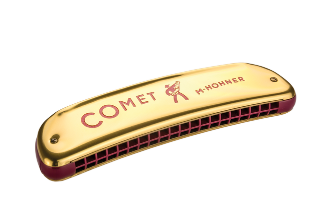 The image shows a Hohner "Comet" diatonic harmonica with a gold metal cover plate featuring red "COMET" text and the Hohner logo. It has a red/burgundy comb visible at the bottom where the reed chambers are located. Hohner is a renowned German maker of harmonicas and musical instruments for over 160 years.