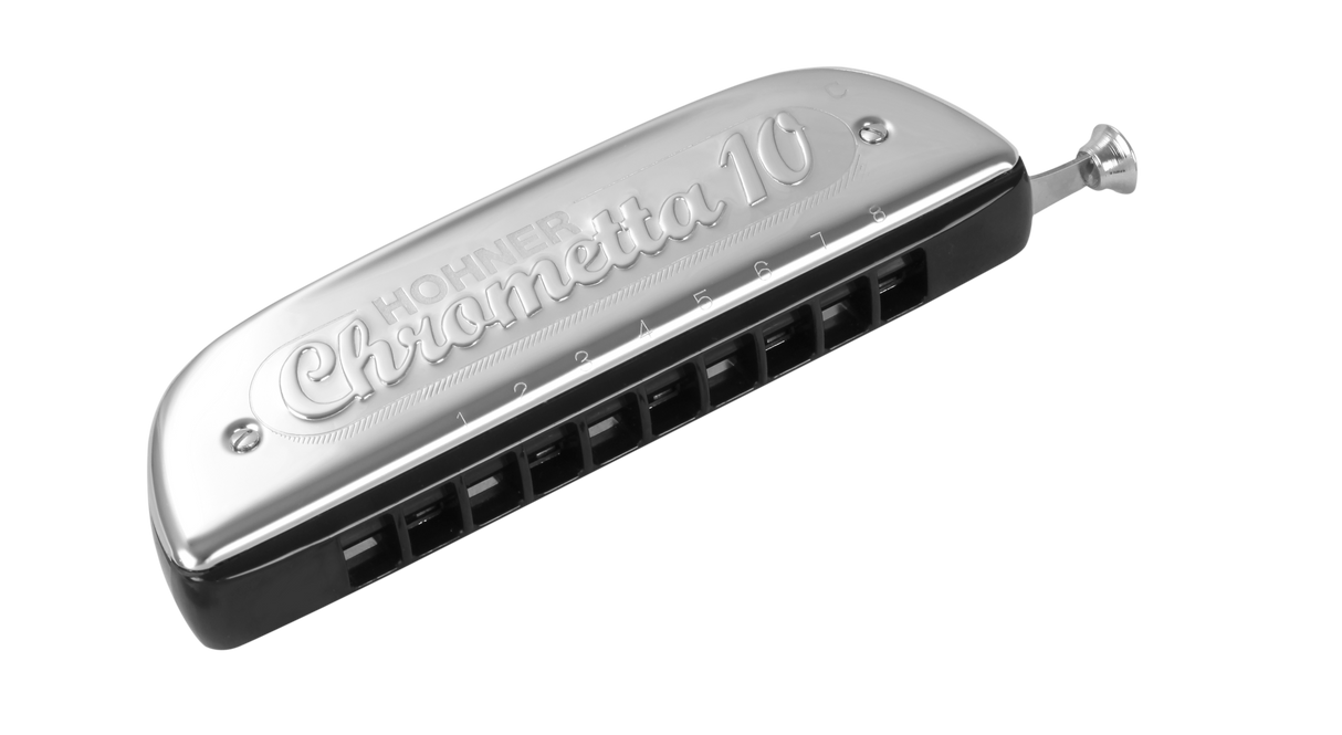 The image shows a Hohner Chrometta 10 chromatic harmonica with chrome-plated metal covers and a black plastic comb. It features 10 holes, a slide button on the right for accessing sharps and flats, and engraved branding. This intermediate-level wind instrument offers 2.5 octaves and full chromatic range, made by the renowned German manufacturer Hohner.