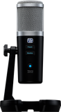 The image shows a professional USB large-diaphragm condenser microphone with a silver mesh grille and black body on a desktop stand. It features preset and monitor buttons, a volume knob with blue LED and push-to-mute function. Branded with a logo resembling "PreSonus," it’s ideal for home studio recording, podcasting, voice-over, and instrument capture, favored for its studio quality and easy plug-and-play USB connectivity.