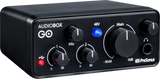 The image shows a PreSonus AudioBox GO, a compact 2-channel USB audio interface for recording and music production. It features input gain controls, 48V phantom power (blue LED), mix control, main output volume knob, headphone jack (3.5mm), and USB connectivity (red LED). Markings indicate gain and output levels. Popular for its portability, bus-powered design, and suitability for musicians, podcasters, and home studios.