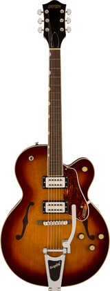 The image shows a Gretsch hollow body electric guitar with a sunburst finish and f-holes. It features two Filter'Tron style humbucking pickups, a Bigsby vibrato tailpiece, chrome hardware, and multiple control knobs. The dark headstock displays a gold "GRETSCH" logo with six chrome tuners. Additional details include a bound rosewood fretboard, tortoiseshell pickguard, and white body binding, showcasing Gretsch’s classic vintage design.