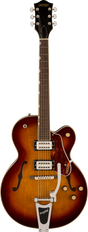 The image shows a Gretsch hollow body electric guitar with a sunburst finish and f-holes. It features two Filter'Tron style humbucking pickups, a Bigsby vibrato tailpiece, chrome hardware, and multiple control knobs. The dark headstock displays a gold "GRETSCH" logo with six chrome tuners. Additional details include a bound rosewood fretboard, tortoiseshell pickguard, and white body binding, showcasing Gretsch’s classic vintage design.