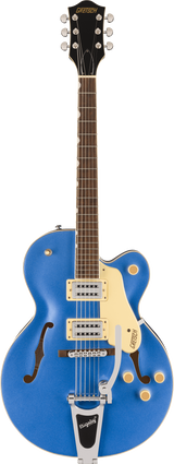 The image shows a Gretsch hollow-body electric guitar with a vibrant blue finish and cream pickguard. It features visible f-holes, dual humbucker pickups with cream rings, a Bigsby vibrato tailpiece, a bound neck with a dark wood fretboard, chrome tuning machines, and the classic Gretsch headstock and branding. This model is likely from Gretsch’s professional Electromatic or Pro line, known for rockabilly, jazz, and country music.