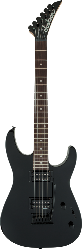 The image shows a matte black Jackson electric guitar with a solid double-cutaway body and sharp angular horns. It features two humbucker pickups with black rings, black hardware, a dark rosewood or ebony fretboard with dot inlays, and Jackson’s signature pointed headstock with six-in-line tuners. Volume and tone controls are visible. This modern, sleek guitar is designed for metal and rock playing styles.