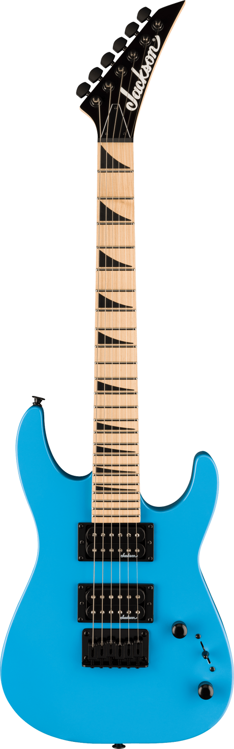 The image shows a Jackson electric guitar with a bright blue superstrat body, HSH black pickups, and black hardware. It features a maple fretboard with black shark fin inlays, a black pointed headstock with the Jackson logo, and six black tuning pegs. Volume and tone knobs and a pickup selector are visible. This modern Jackson model is designed for rock and metal with its fast neck and aggressive style.