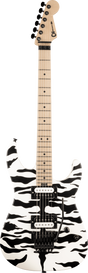 The image shows a Charvel electric guitar with a white body featuring a bold black abstract or camouflage pattern. It has two black humbucker pickups, a black tremolo bridge, black control knobs, and hardware. The neck is light-colored with dot inlays, and the headstock has black tuning pegs. This modern guitar is designed for rock or metal styles, combining visual impact with versatile hardware for expressive playing.