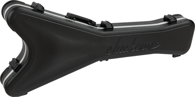 The image shows a black molded hard shell guitar case with the "Jackson" logo embossed on it. It features 3-4 secure latches and a contoured shape to fit electric guitars. Made from heavy-duty plastic or composite, this professional-grade case offers strong protection for transport and storage, primarily designed for Jackson guitars but may fit similar models.