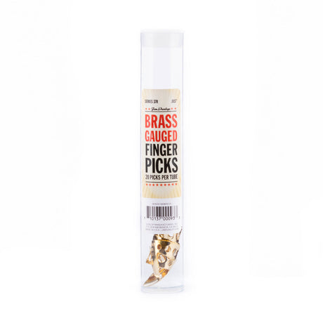A clear plastic tube filled with brass guitar fingerpicks on a white background