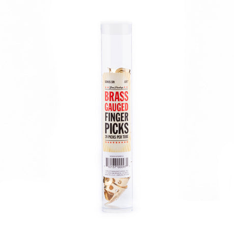 A plastic tube filled with brass fingerpicks for guitar on a white background