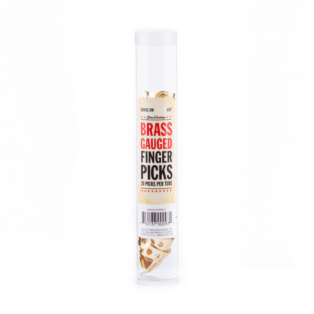 A plastic tube filled with brass fingerpicks for guitar on a white background