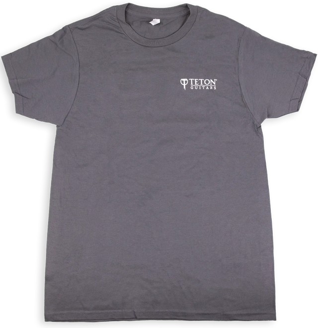 The image shows a gray t-shirt with the "Teton Guitars" logo printed in white on the chest. This branded apparel is merchandise from Teton Guitars, a company known for producing acoustic guitars. The shirt likely serves as promotional or fan gear, representing the type of merchandise musical instrument manufacturers create to promote their brand and generate additional revenue.