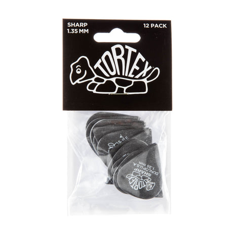 A package with a plastic bag filled with black 'Dunlop' branded guitar picks on a white background