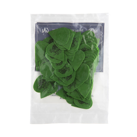 A plastic bag filled with green 'Dunlop' branded guitar picks on a white background