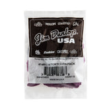 A plastic package fill with 'Dunlop' branded guitar picks on a white background