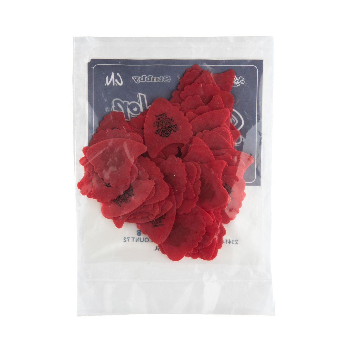 A plastic package fill with red 'Dunlop' branded guitar picks on a white background