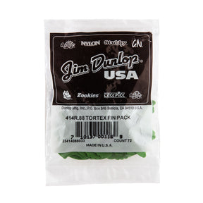 A plastic package bag filled with 'Dunlop' branded guitar picks on a white background