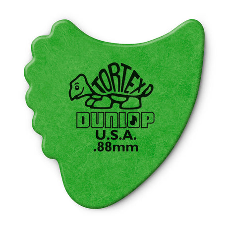 A green 'Dunlop' branded fin guitar pick with a Tortex turtle design on a white background
