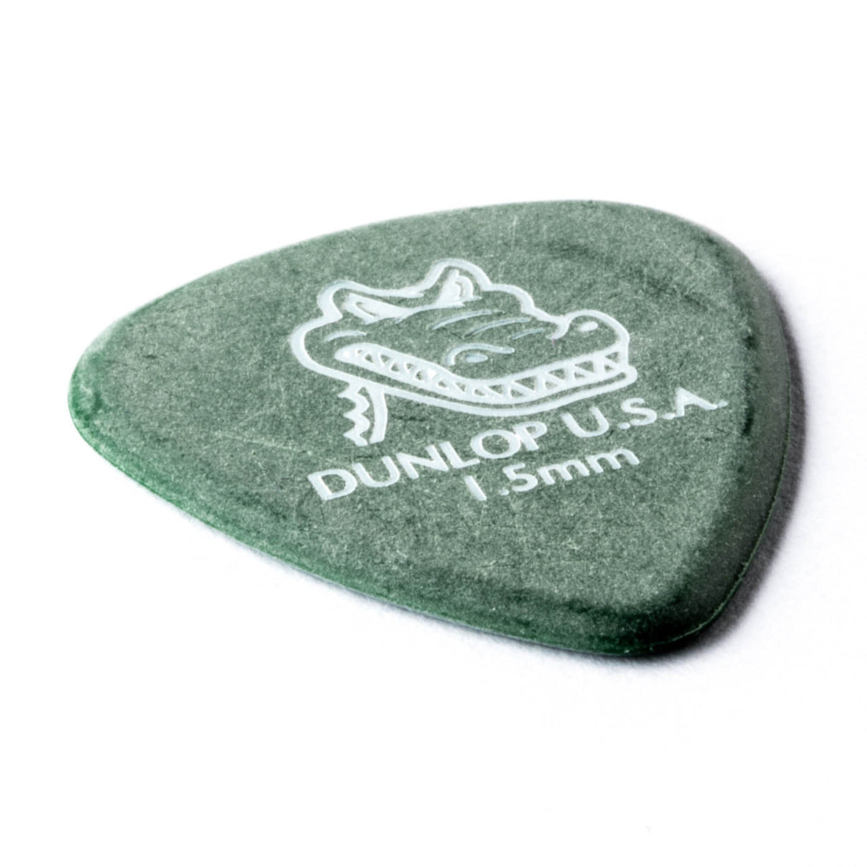 Green guitar pick with Dunlop USA branding on a white background