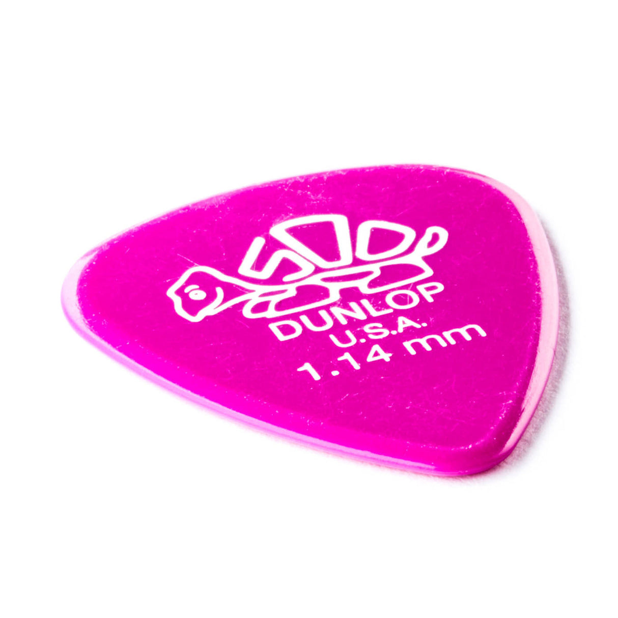 A 'Dunlop' branded purple guitar pick with a turtle design on a white background