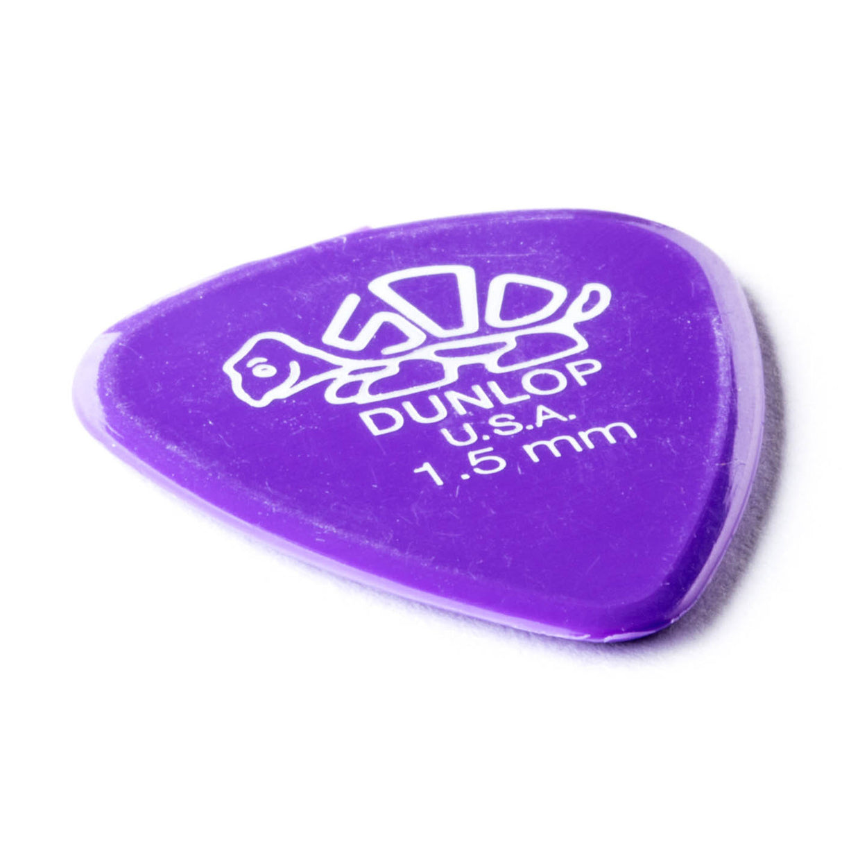 A purple 'Dunlop' branded guitar pick with a turtle design on a white background