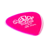 A pink 'Dunlop' branded guitar pick with a turtle design on a white background