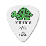 White guitar pick with green turtle logo and Dunlop branding on a white background