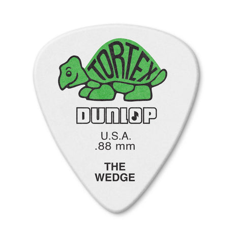 White guitar pick with green turtle logo and Dunlop branding on a white background