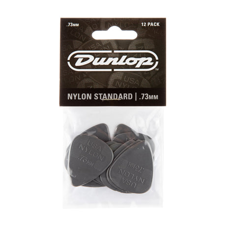 Pack of Dunlop guitar picks with clear plastic window on a white background