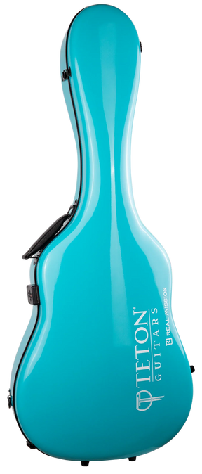 The image shows a turquoise hard shell guitar case with a sleek, glossy finish and ergonomic curved design. It features black latches, a comfortable handle, and the brand name "TETON GUITARS" in white along with a logo and "REAL MUSIC" text. This modern, lightweight case offers high-quality protection for acoustic guitars with a vibrant, eye-catching color.