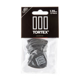Tortex guitar picks in a clear plastic package with black background