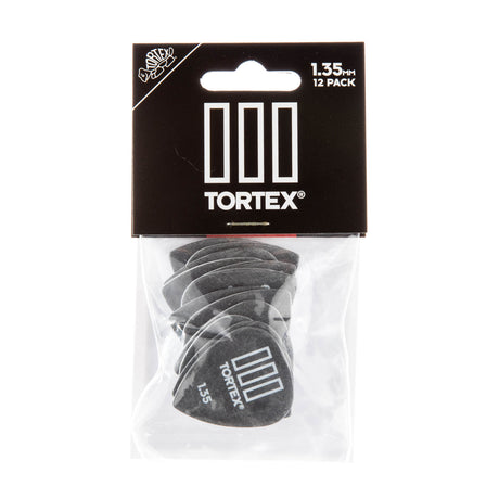 Tortex guitar picks in a clear plastic package with black background