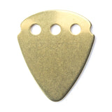 Gold guitar pick on a white background