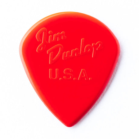 A white guitar pick with Jim Dunlop USA engraving on a white background