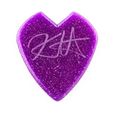 Purple glittery heart-shaped guitar pick with a signature on a white background