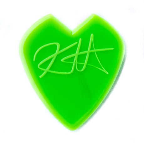 Green heart-shaped guitar pick with a signature on a white background