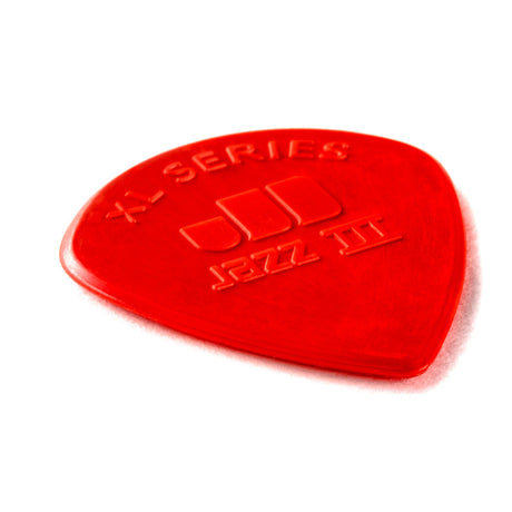 Red guitar pick with 'XL Series' and 'Jazz III' branding on a white background