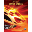The image shows a piano music book titled "5 Finger Movie Heroes" by Tom Gerou, published by Alfred Music. The cover features golden film reels on a red-orange gradient background with small movie stills inside a reel. It contains beginner-level piano arrangements of 9 popular movie themes using five-finger positioning, with optional duet accompaniments for student and teacher play.
