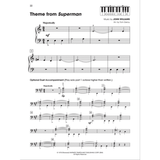 The image shows page 22 of a piano music book featuring the "Theme from Superman" by John Williams, arranged by Tom Gerou. It includes treble and bass clefs, a "Majestically" tempo marking, a keyboard diagram, optional duet bass clef part (played one octave higher), measure numbers with rehearsal marks, dynamic markings like "mf," and Warner Bros. copyright info. This is a beginner-to-intermediate piano arrangement with duet option.