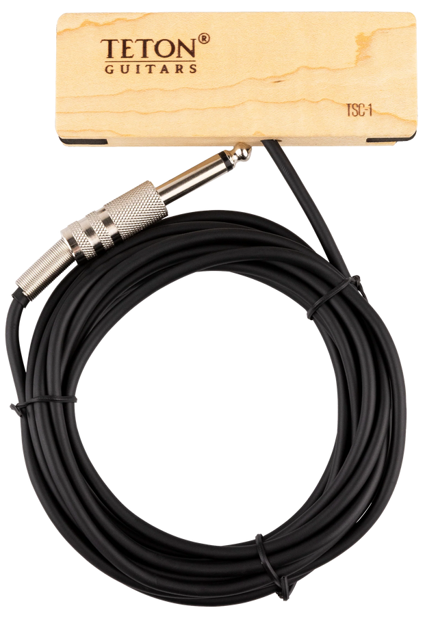 The image shows a black coiled 1/4" instrument cable from TETON Guitars with metal knurled 1/4" TS connectors on both ends. A wooden product tag with natural wood grain and TETON branding, labeled "TSC-1," accompanies the cable. This cable is designed for connecting electric guitars, basses, or other instruments to amps, pedals, or interfaces, complementing TETON’s acoustic guitar accessories.