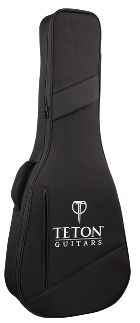 The image shows a black Teton Guitars soft guitar gig bag with a textured fabric surface, white Teton logo and brand name, and a "T" logo at the top. It features diagonal accent stripes, a full-length zipper, and padded shoulder straps. Designed for acoustic guitars, it offers lightweight, portable protection with a sleek, professional look.