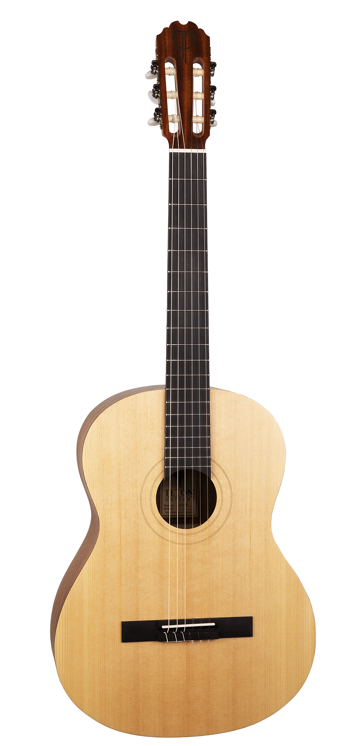 The image shows a full-size classical acoustic guitar with a light wooden body and a circular sound hole featuring decorative rosette rings. It has a black bridge, a long neck with a dark fretboard and visible fret markers, and a traditional headstock with six classical-style tuning pegs. Six nylon or steel strings run from the bridge to the tuners. The guitar has a natural wood finish and appears well-maintained.