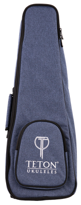 The image shows a blue denim-like ukulele gig bag with the "TETON UKULELES" logo on the front pocket. It features a zippered closure around the perimeter, a front storage pocket, and carrying straps (partially visible). This padded soft case is designed to protect and transport a ukulele, offering a lightweight, protective option. Teton is a well-known brand for acoustic instruments and accessories.