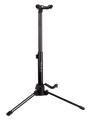 The image shows a black professional-grade tripod guitar stand with an adjustable central pole, three folding legs for stability, an upper cradle for the guitar neck, and a lower arm to support the body. The brand "DELTON" is visible on the pole. This sturdy, height-adjustable stand is used by guitarists to securely display and store acoustic or electric guitars in studios, on stage, or at home.