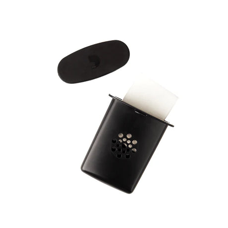 The image shows a straight mute for a brass instrument, likely a trumpet or cornet. It features a black oval top, a black conical body with circular ventilation holes, and a white cork or rubber seal to secure it inside the bell. This mute reduces volume and alters tone, producing a muffled sound while allowing some air to escape, making it useful for quiet practice in noise-sensitive settings.