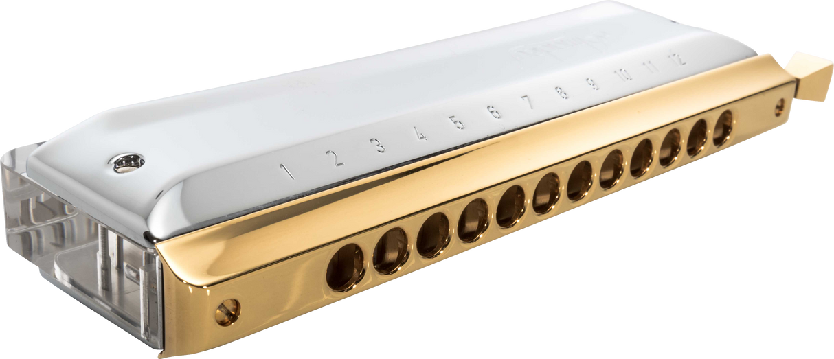 The image shows a chromatic harmonica with a gold-colored metal comb, clear plastic cover plates, and multiple round holes numbered along the top. It features a side-mounted slide button, enabling access to all 12 chromatic notes. This sophisticated instrument is designed for versatility in genres like jazz and classical, indicating it is a high-quality model suited for professional musicians.