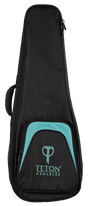 The image shows a TETON UKULELES black soft-shell ukulele gig bag with turquoise/teal accents on the front pocket. It features the TETON logo and "UKULELES" text, multiple zippers, a side handle, and padded construction for protection. This lightweight, portable case is designed to safeguard the instrument from minor bumps and weather, offering a professional look likely bundled with or sold for TETON ukuleles.