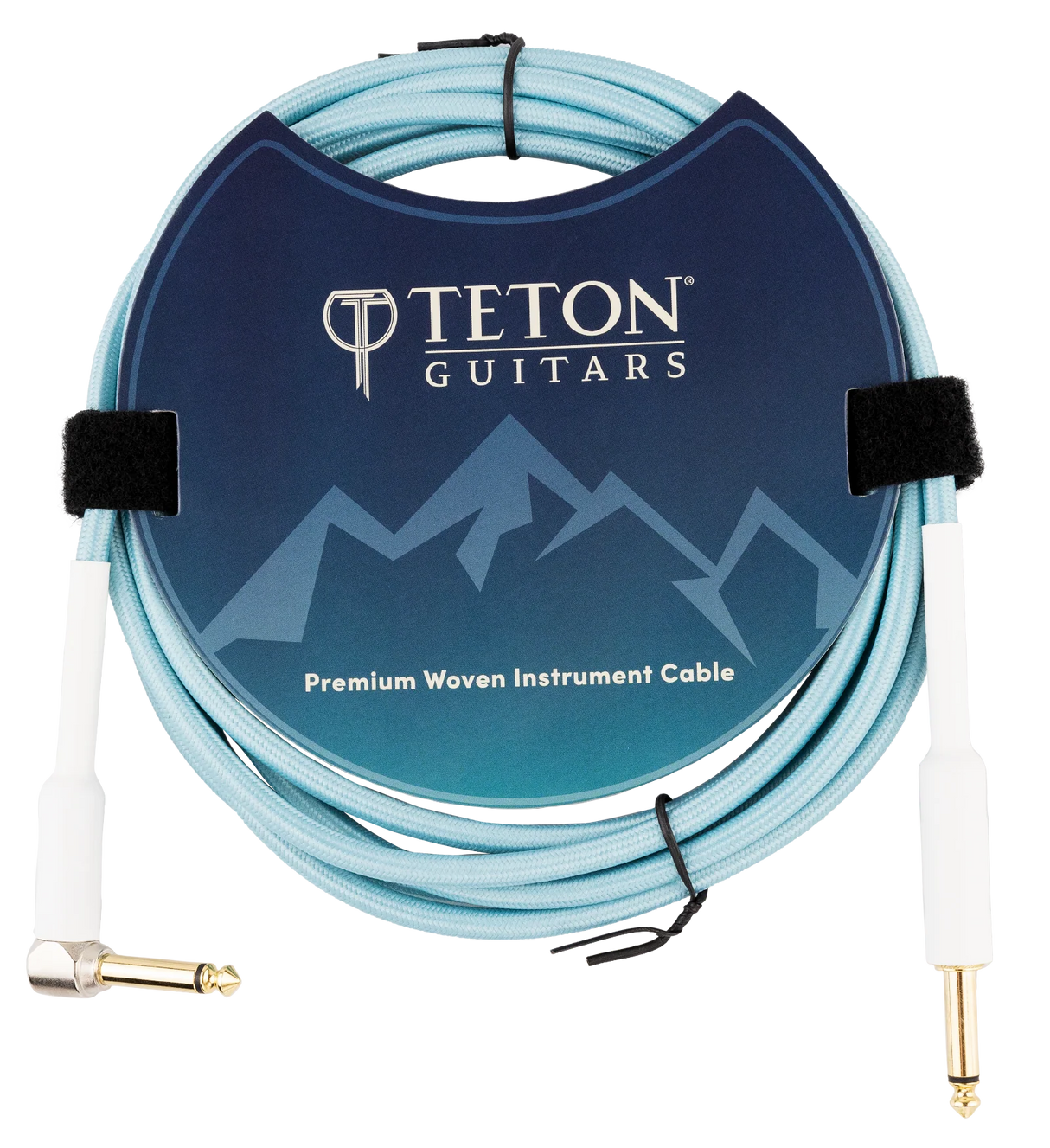 The image shows a Teton Guitars Premium Woven Instrument Cable with a light blue woven exterior for durability. It features gold-plated 1/4" TS connectors—one straight and one right-angle—and includes Velcro ties for organization. The cable is neatly coiled and displayed in professional packaging with Teton Guitars branding, designed for connecting electric guitars or basses to amplifiers or audio gear.